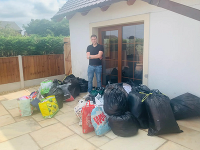 210830_Stuart_with_items Team member Stuart with some of the collected items for Afghan refugees
